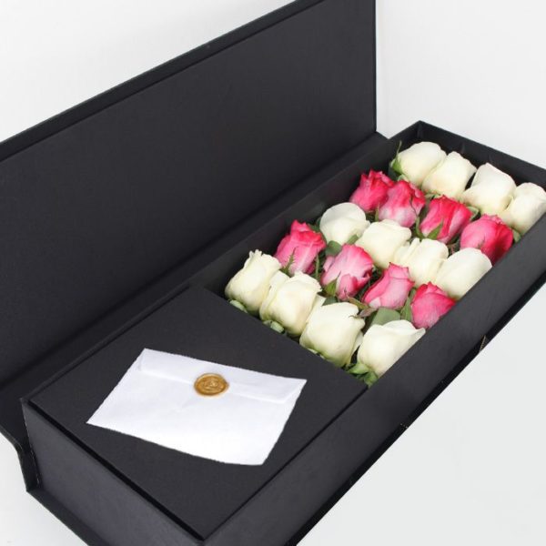 purple roses in a box