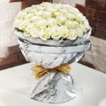white_roses_in_marbled_wrapping