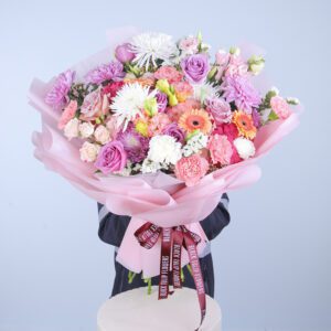 A gracefully display of a vibrant bouquet of assorted flowers, showcasing nature's beauty and elegance.