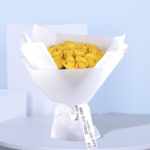 A vibrant yellow rose bouquet arranged cheerfully to brighten your day or gift someone.